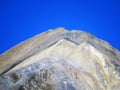 High swiss alpine peak Piz Linard (2767 m) above the tourist-agricultural village Alvaneu Bad (Alvagni Bogn) Royalty Free Stock Photo