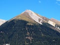 High swiss alpine peak Piz Mulain (2627 m) above the tourist-agricultural village Alvaneu Bad (Alvagni Bogn)