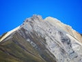 High swiss alpine peak Piz Mulain (2627 m) above the tourist-agricultural village Alvaneu Bad (Alvagni Bogn)