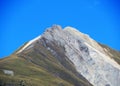 High swiss alpine peak Piz Mulain (2627 m) above the tourist-agricultural village Alvaneu Bad (Alvagni Bogn)