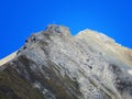 High swiss alpine peak Piz Mulain (2627 m) above the tourist-agricultural village Alvaneu Bad (Alvagni Bogn)