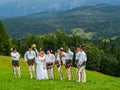 High Tatra mountains in Poland. View from Lapszanka near Zakopan. People in traditional outfit having wedding photoshoot in