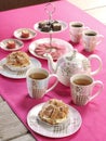 High tea on a pink tablecloth Royalty Free Stock Photo