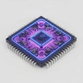 A high-tech computer processor unit with vibrant glowing pink and blue circuit board pathways Royalty Free Stock Photo