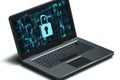 High tech cyber security laptop glowing blue padlock on screen representing hacking protection encryption online data safety in