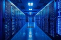 A high-tech data center features rows of servers glowing in blue light, highlighting the Royalty Free Stock Photo