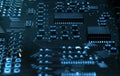 High-tech electronic board PCB with processor, microcircuits and luminous digital electronic signals. Close up macro photography