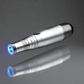 High-Tech Silver Flashlight with Blue LED Illumination Royalty Free Stock Photo