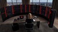 Cybersecurity Expert in Futuristic Multi-Screen Command Center Royalty Free Stock Photo