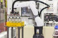 High technology of precision and accuracy industrial robot arm during working glass bottle lift from plastic box with automatic