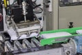 High technology and precision robot grip with automatic vacuum for catch goods bag on roller conveyor at factory