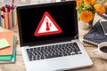 High temperature warning sign on a laptop screen.  Computer overheat, overload, hot weather danger Royalty Free Stock Photo