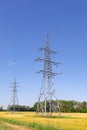 High Tension Line on a summer field. Summer photo Royalty Free Stock Photo