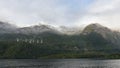 High tension power lines running across the mountain at Lake Manapouri in New Zealand Royalty Free Stock Photo