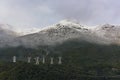 High tension power lines running across the mountain at Lake Manapouri in New Zealand Royalty Free Stock Photo