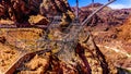 The High Tension Power Lines and supporting Towers on the Walls of Black Canyon at the Hoover Dam Royalty Free Stock Photo