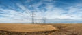 High tension power lines and towers Royalty Free Stock Photo