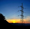 High tension pylon during sunrise Royalty Free Stock Photo