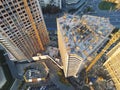 High tower building construction site. Bug industrial crane. Aerial drone view. Metropolis city development