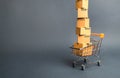 High tower of cardboard boxes on a supermarket trolley. concept of shopping in online store. E-commerce, sales and sale of goods