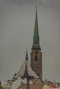 High tower of church in Pilsen city in dark grey cloudy day