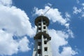 High tower with crane in cloudy sky Royalty Free Stock Photo