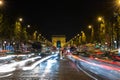 The high traffic(blurred motion) on avenue Champs-Elysees at night, Paris, France.