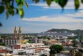 High vantage point of downtown Mazatlan with a large cruise ship docked at the harbor and an old church in the middle Royalty Free Stock Photo