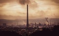 High view across industrial town to steel works and smoke stacks on stormy atmospheric evening. Old industries, climate change and Royalty Free Stock Photo