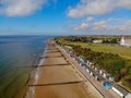 Beach frinton on sea essex groins seaside water ocean blue clouds beach huts grass view waves steps trees