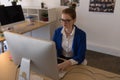 Business woman working on personal computer at desk Royalty Free Stock Photo