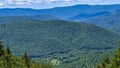 High View of a Mountain Lake Looking Over Evergreens and Pine Trees Royalty Free Stock Photo