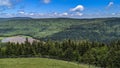 High View of a Mountain Lake Looking Over Evergreens and Pine Trees Royalty Free Stock Photo