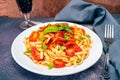 High view of a plate of spaghetti pasta with a delicious homemade tomato sauce with homemade basil leaves. Homemade and natural Royalty Free Stock Photo