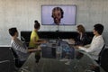 Business colleagues attending a video call in a conference room Royalty Free Stock Photo