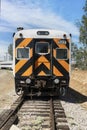 high visibility black and orange stripes on last car in train.