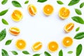 High vitamin C, Juicy and sweet. Frame made of fresh orange fruit with green leaves on white background Royalty Free Stock Photo