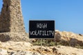 High volatility symbol. Concept words High volatility on beautiful black chalk blackboard. Chalkboard. Beautiful stone blue sky