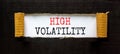 High volatility symbol. Concept words High volatility on beautiful white paper. Beautiful black paper background. Business high