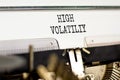 High volatility symbol. Concept words High volatility typed on beautiful old retro typewriter. Beautiful white paper background.