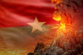 high volcano blast eruption at night with explosion on Burkina Faso flag background, problems of eruption and volcanic earthquake