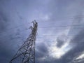 High voltage cable tower with cloudy sky Royalty Free Stock Photo