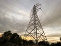 High voltage cable tower with cloudy sky Royalty Free Stock Photo