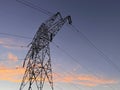 High voltage cable tower during sunset Royalty Free Stock Photo
