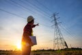 High voltage, construction electrical engineer or technician standing and watching at the worker checking location site near to Royalty Free Stock Photo