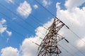 High-voltage electric main against the dark blue sky in summer day Royalty Free Stock Photo