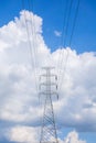 high voltage electric pole in the middle of the field Royalty Free Stock Photo