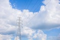 high voltage electric pole in the middle of the field Royalty Free Stock Photo