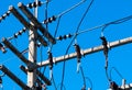 High voltage electric pole and transmission lines with clear blue sky. Electricity pylon. Power and energy engineering system. Royalty Free Stock Photo