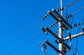 High voltage electric pole and transmission lines with clear blue sky. Electricity pylon. Power and energy engineering system. Royalty Free Stock Photo